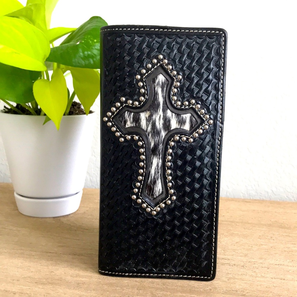 Genuine hand-tooled leather wallet.